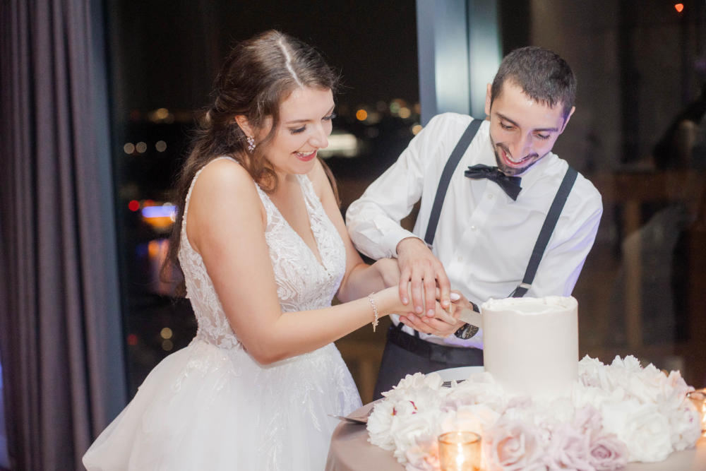 bride and groom cut single tier white wedding cake
