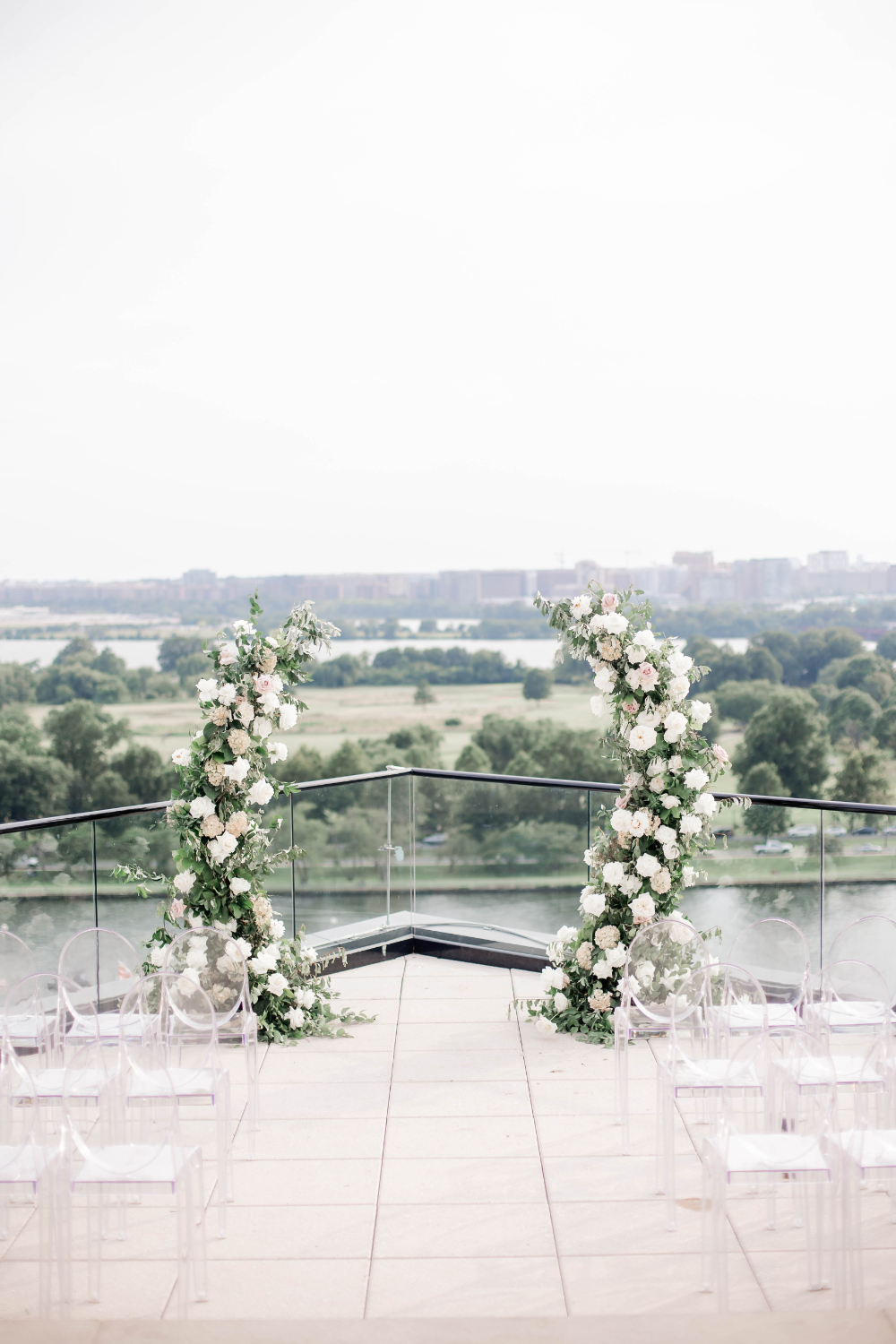 white blush and greenery wedding ceremony decor