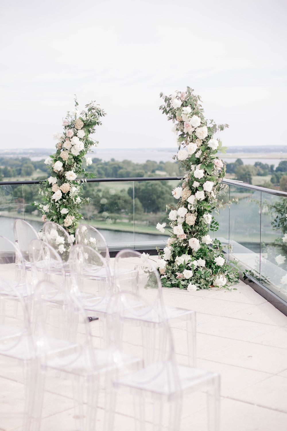 outdoor wedding ceremony at La Vie with acrylic ghost chairs and white and blush wedding florals
