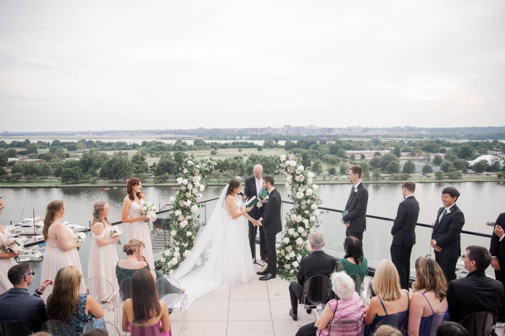 bride and groom get married by DC waterfront