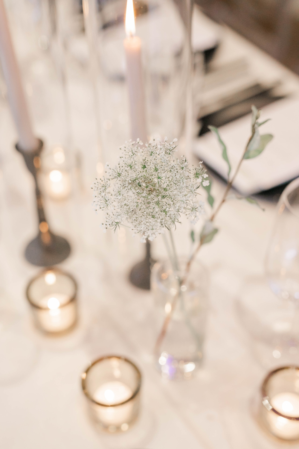 closeup of delicate flowers and candle centerpieces