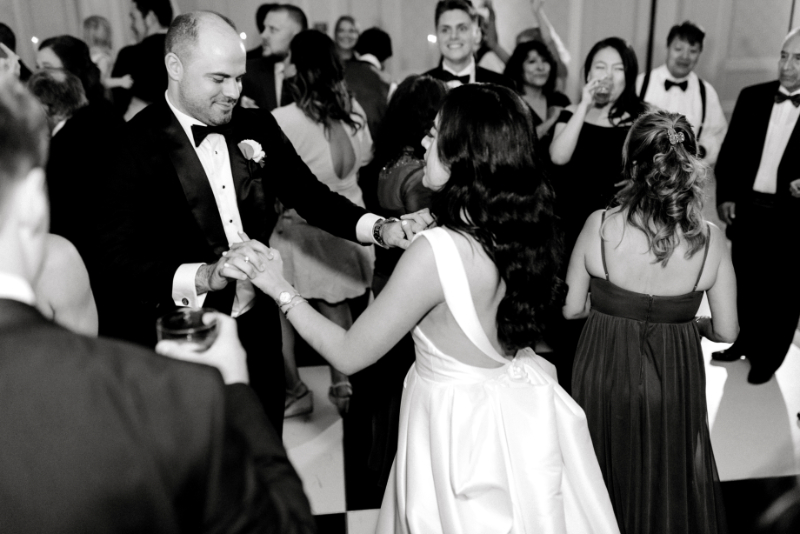 black and white wedding photos of bride and groom on the dance floor