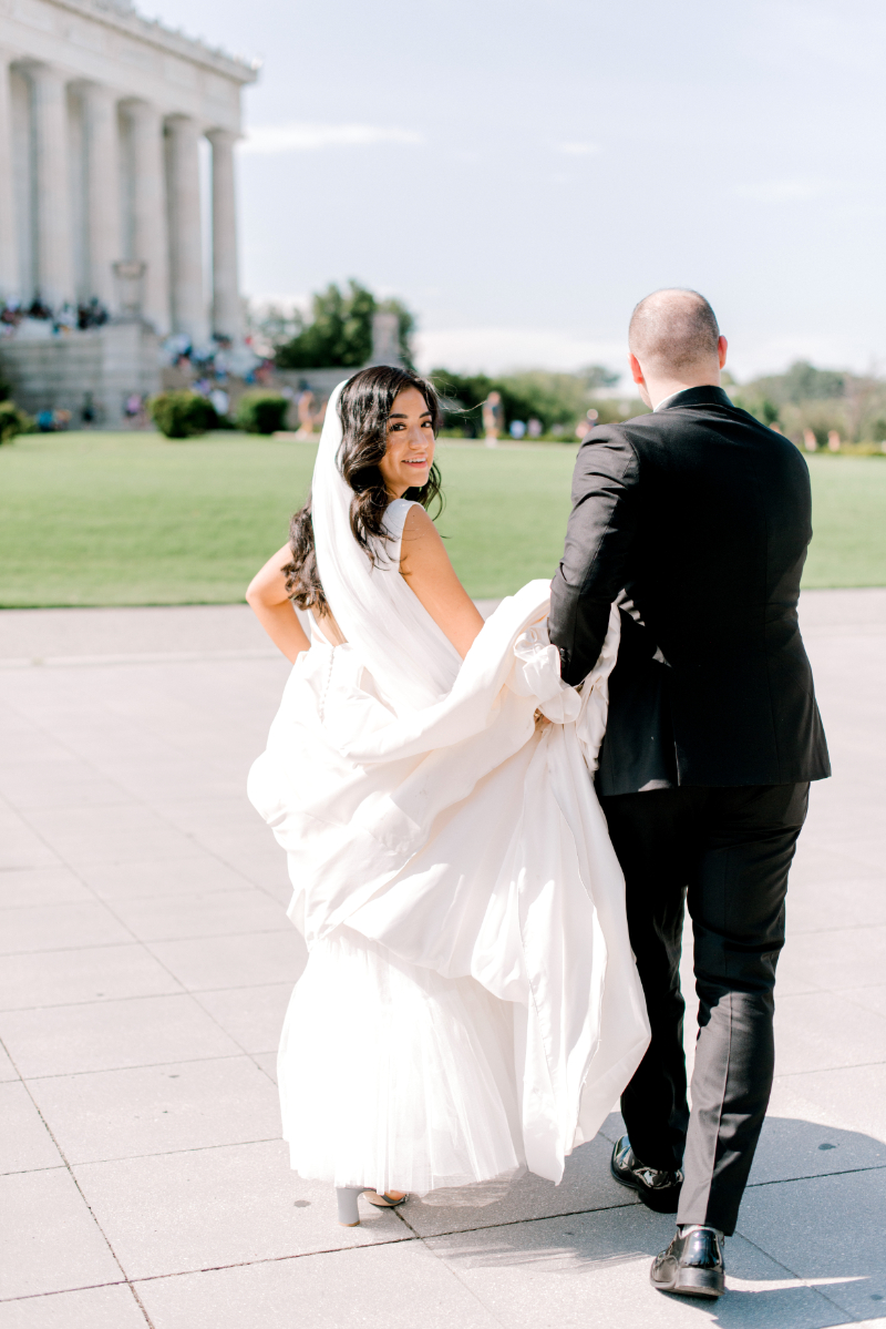 bride and groom walk to DC wedding venue