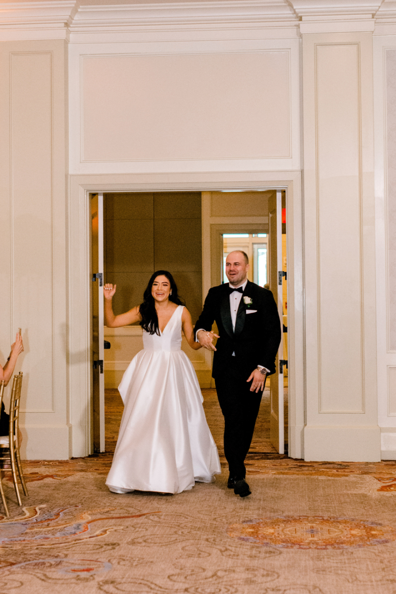 bride and groom enter DC wedding venue