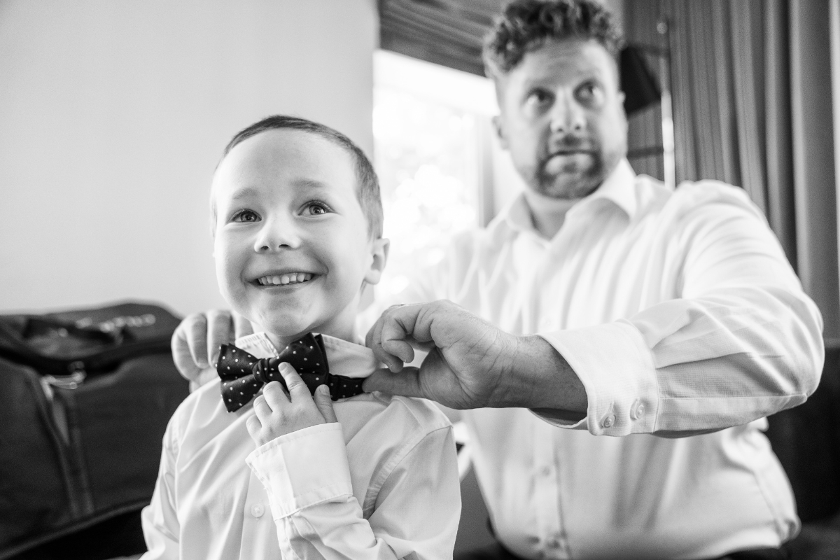 black and white getting ready wedding photos with groom and kids