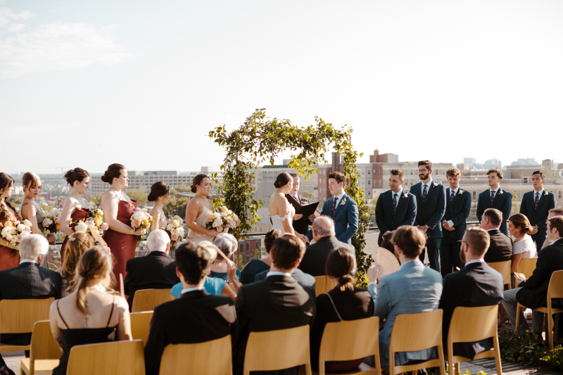 bride and groom exchange vows with DC skyline as the backdrop