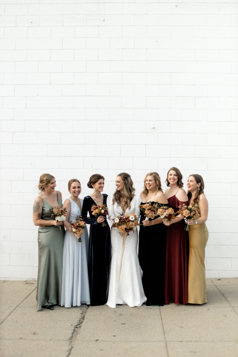 bride and bridesmaids in mixed dresses