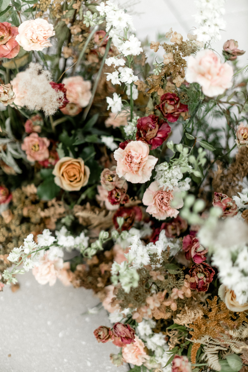 closeup or beige blush and burgundy flowers