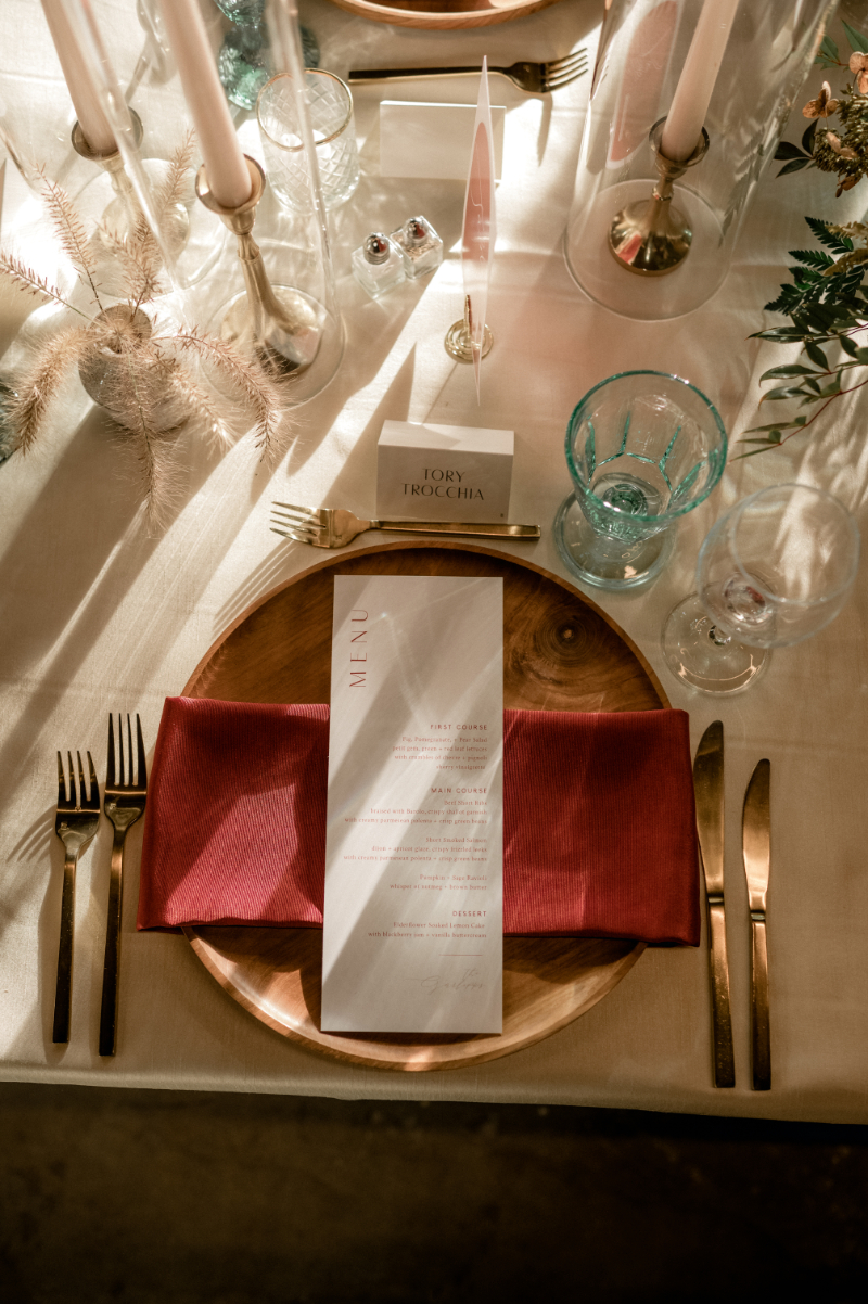 rust colored wedding napkins and menu cards