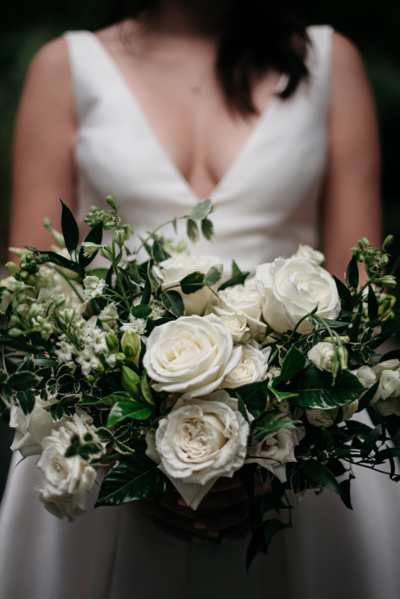 closeup of white flowers and greenery bouquet