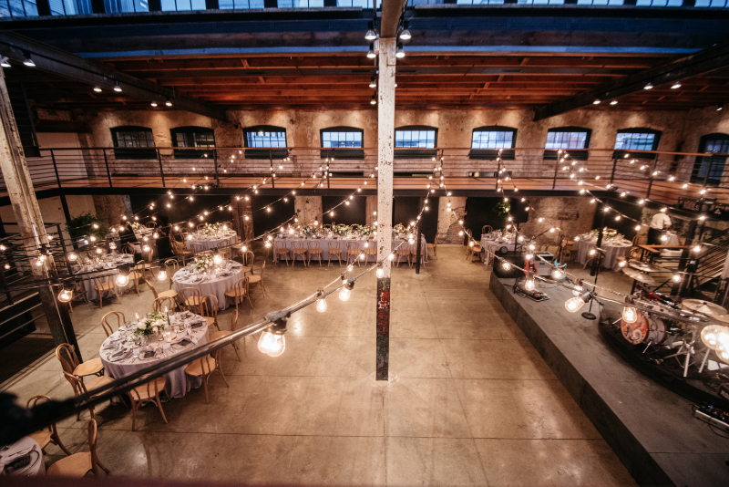 Winslow Room wedding industrial wedding venue with string lights