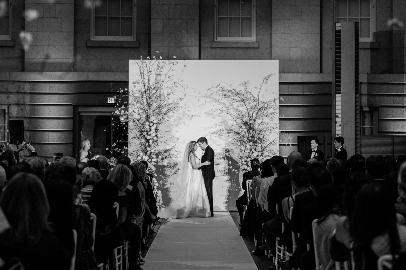 BRIDE AND GROOM AT THE ALTAR FOR WEDDING CEREMONY AT NATIONAL PORTRAIT GALLERY