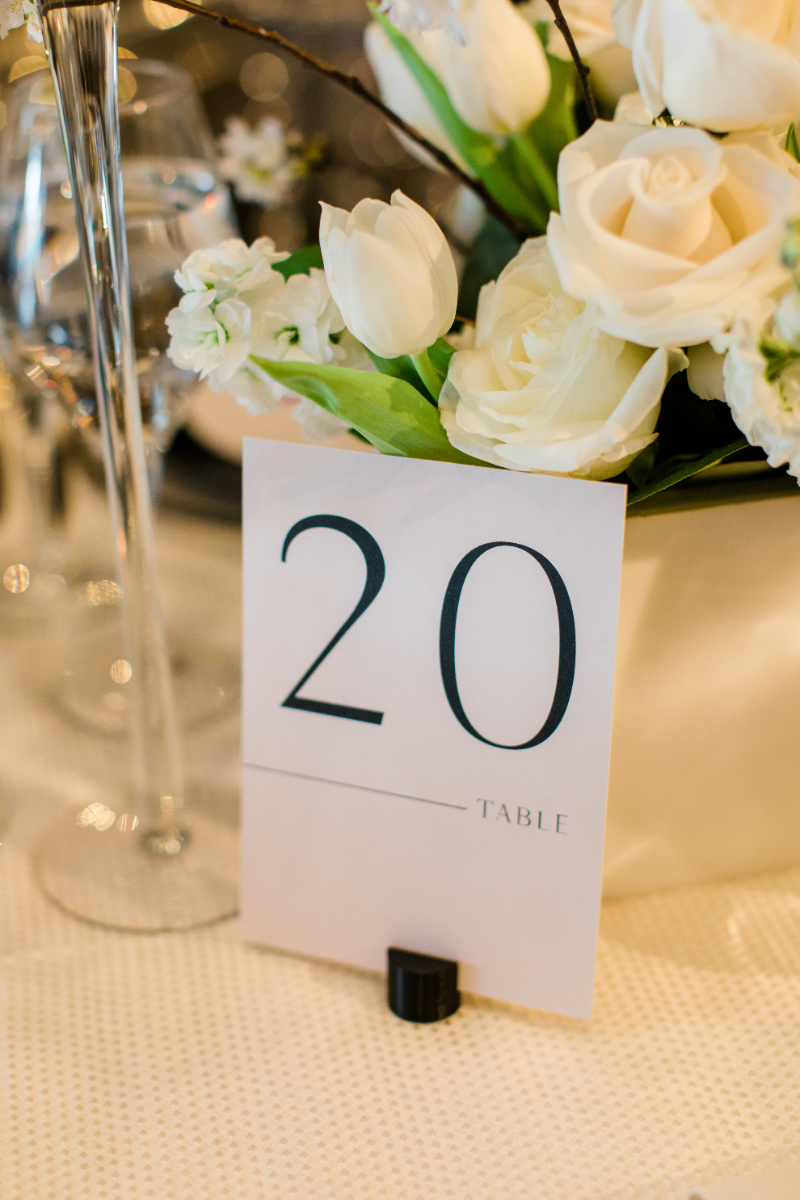 WHITE AND BLACK WEDDING RECEPTION CLOSE UP OF TABLE NUMBER AT NATIONAL PORTRAIT GALLERY KOGOD COURTYARD