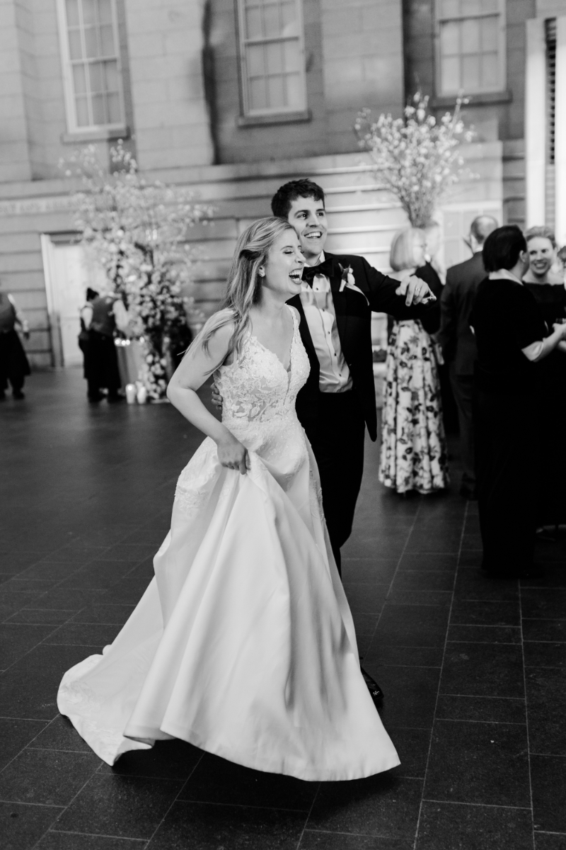 BRIDE AND GROOM ARRIVING AT WEDDING RECEPTION AT NATIONAL PORTRAIT GALLERY KOGOD COURTYARD