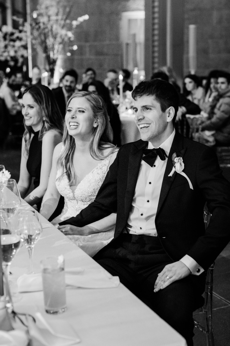 BLACK AND WHITE OF BRIDE AND GROOM SMILING AT WEDDING RECEPTION AT NATIONAL PORTRAIT GALLERY