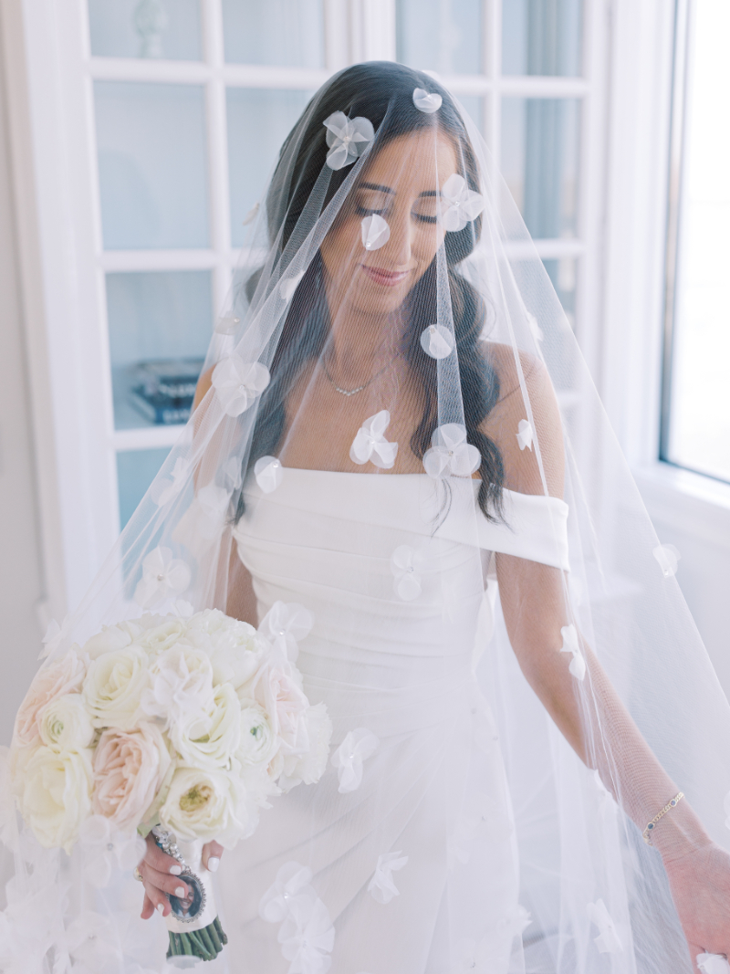 BRIDE IN HER WEDDING DRESS