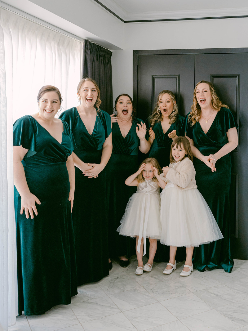 BRIDE FIRST LOOK WITH BRIDESMAIDS AND FLOWER GIRLS