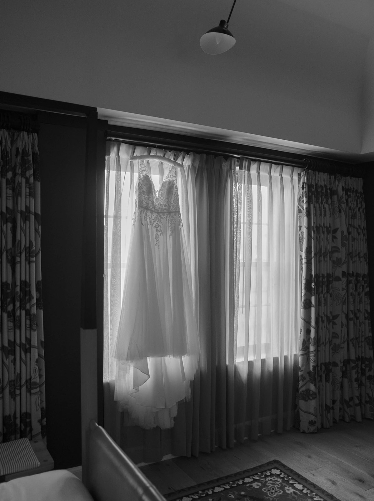BRIDALS WEDDING GOWN HANGING UP IN WINDOW